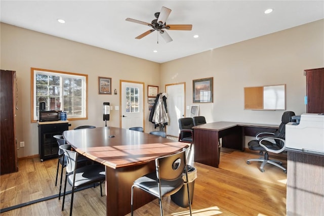 office space with ceiling fan and light hardwood / wood-style floors