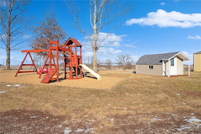 view of playground with a shed and a lawn