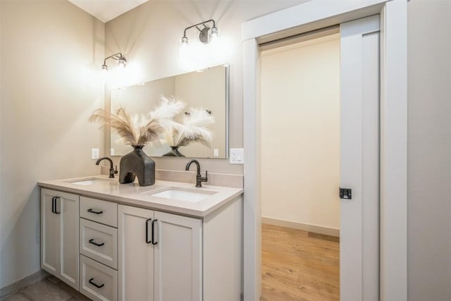 bathroom with hardwood / wood-style flooring and vanity