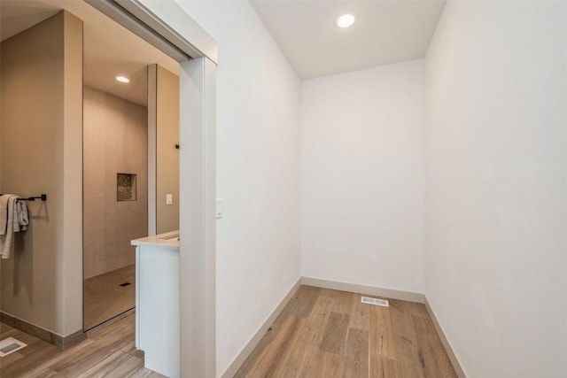 corridor featuring light hardwood / wood-style flooring