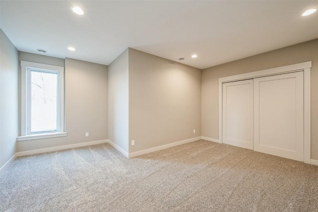 unfurnished bedroom with light carpet