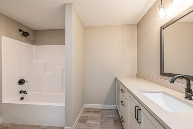 bathroom featuring vanity and bathing tub / shower combination