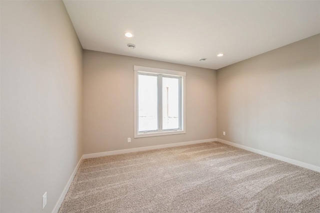 618 J Ave NE, Cedar Rapids, IA 52402 - empty room featuring carpet, baseboards, recessed lighting, and a smoke detector