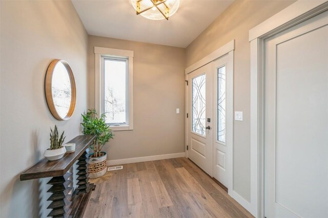 618 J Ave NE, Cedar Rapids, IA 52402 - foyer entrance with wood finished floors and baseboards