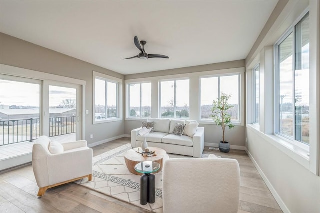 sunroom / solarium with ceiling fan