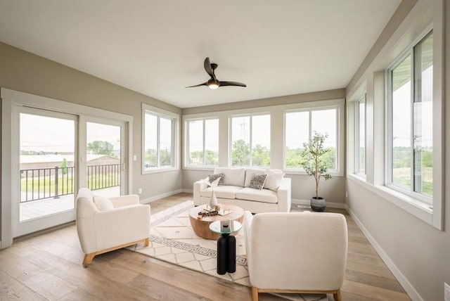 618 J Ave NE, Cedar Rapids, IA 52402 - sunroom with baseboards and wood finished floors