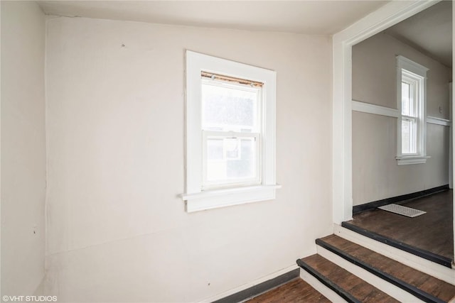 stairs with hardwood / wood-style flooring