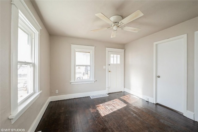 entrance foyer with ceiling fan and dark hardwood / wood-style floors