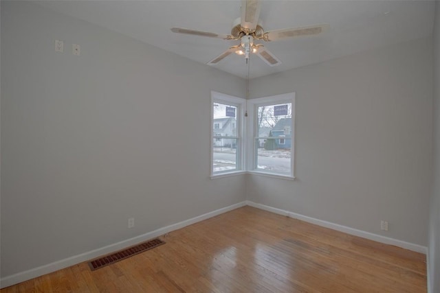 unfurnished room featuring ceiling fan and light hardwood / wood-style flooring