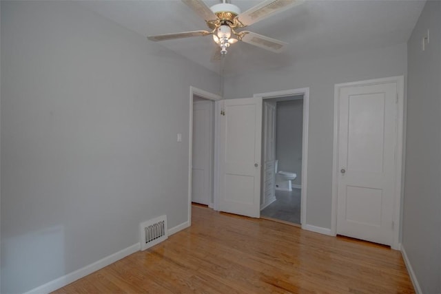 spare room featuring ceiling fan and light wood-type flooring