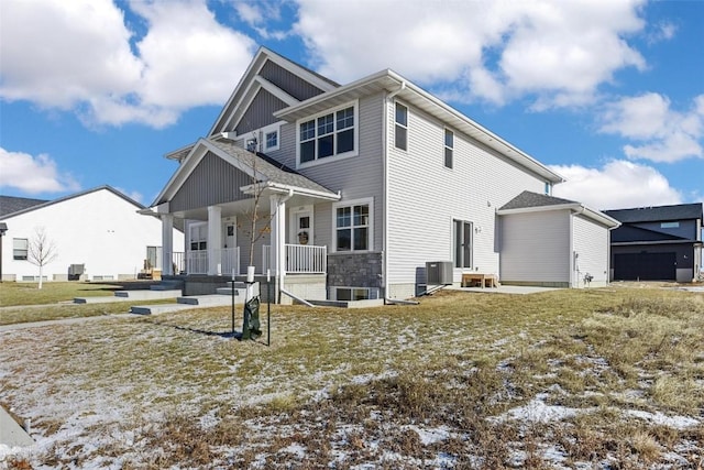 view of front of property with a porch and central AC