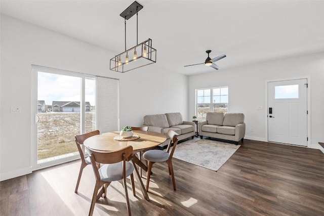 dining area featuring ceiling fan and dark hardwood / wood-style floors