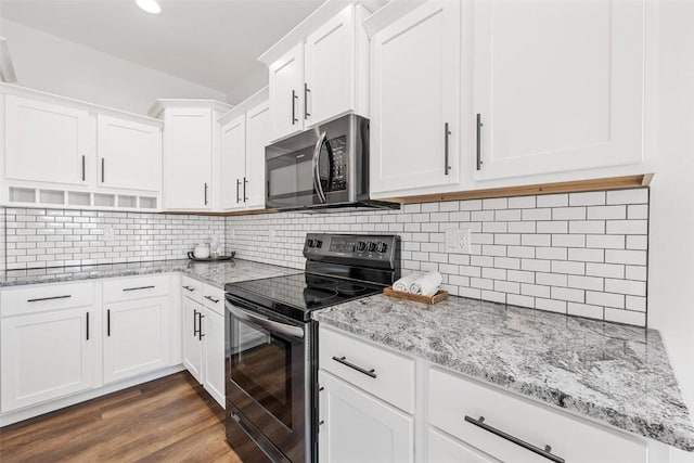 kitchen featuring electric range oven, backsplash, white cabinets, and dark hardwood / wood-style floors