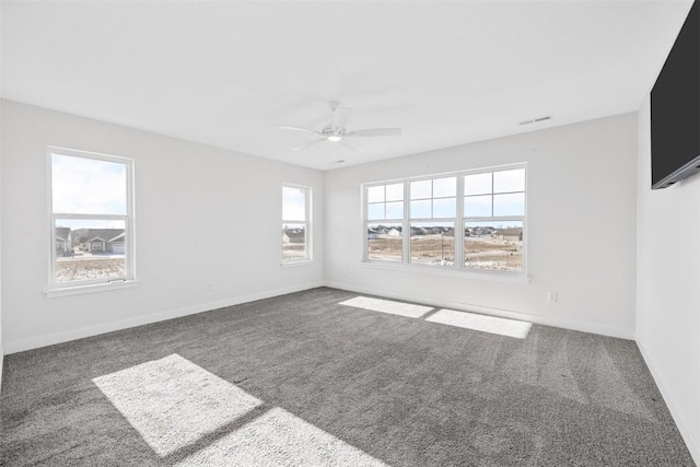 unfurnished room with ceiling fan and carpet floors