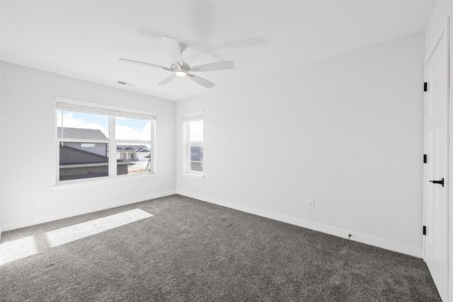 carpeted empty room with ceiling fan