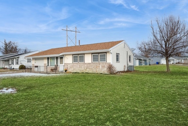 single story home featuring a front yard and central air condition unit