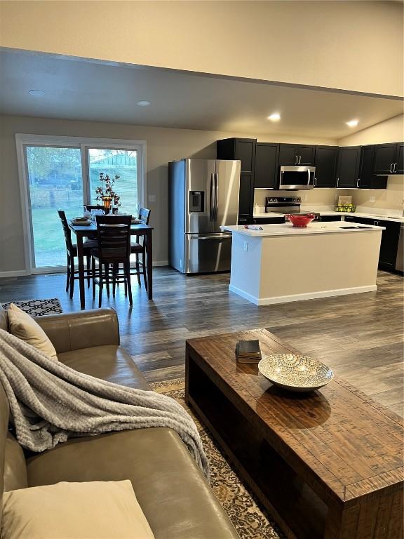 living room featuring dark wood-type flooring