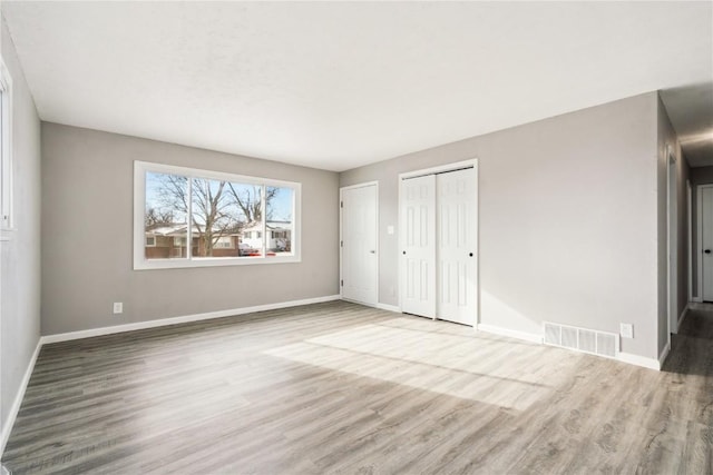 unfurnished bedroom featuring light hardwood / wood-style flooring