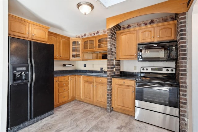 kitchen featuring sink and black appliances