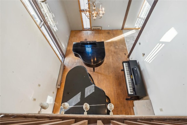 room details featuring an inviting chandelier and wooden walls