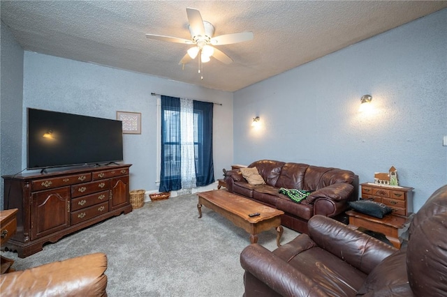 living room featuring a textured ceiling, ceiling fan, and carpet flooring