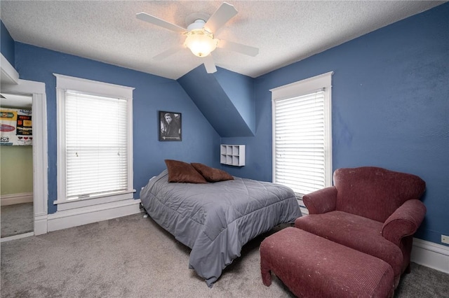 bedroom featuring ceiling fan, light carpet, vaulted ceiling, and a textured ceiling