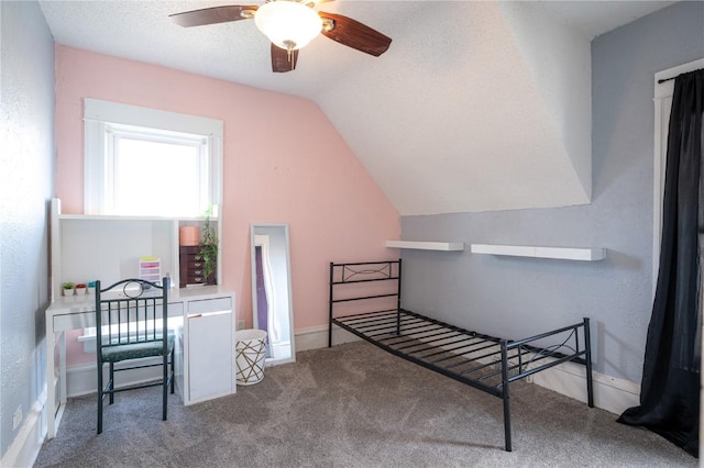 bonus room featuring ceiling fan, a textured ceiling, carpet floors, and lofted ceiling