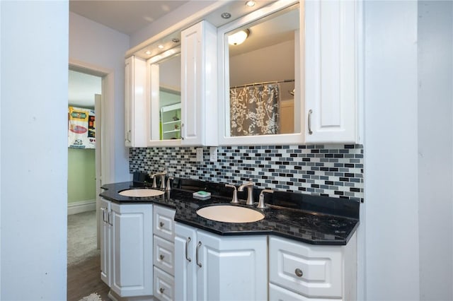 bathroom with vanity and backsplash