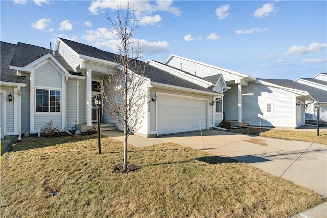 ranch-style house with a front yard and a garage