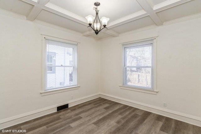 unfurnished room featuring dark wood-type flooring, beam ceiling, a chandelier, and coffered ceiling