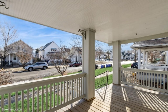 wooden terrace featuring covered porch