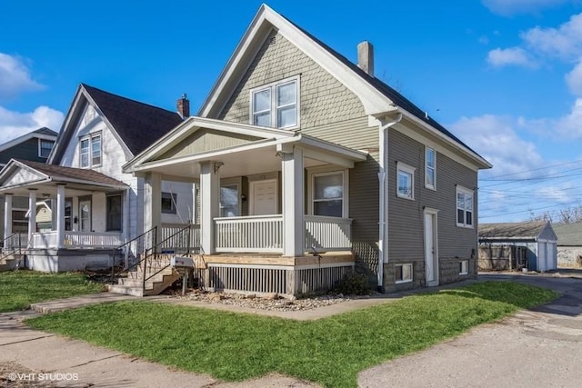 view of front of home featuring a porch and a chimney