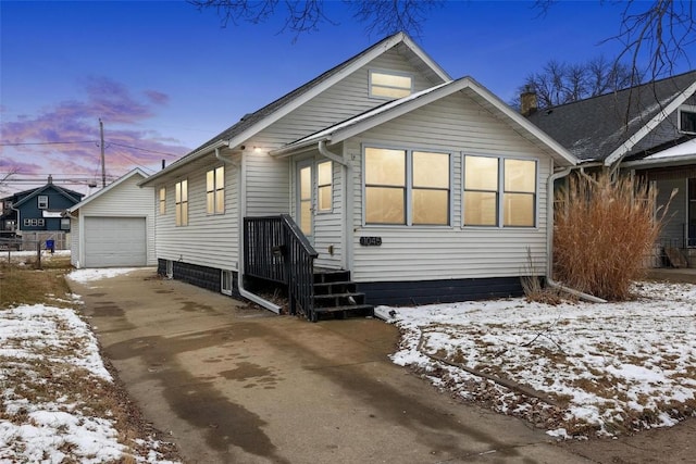 view of front of house featuring a garage and an outdoor structure