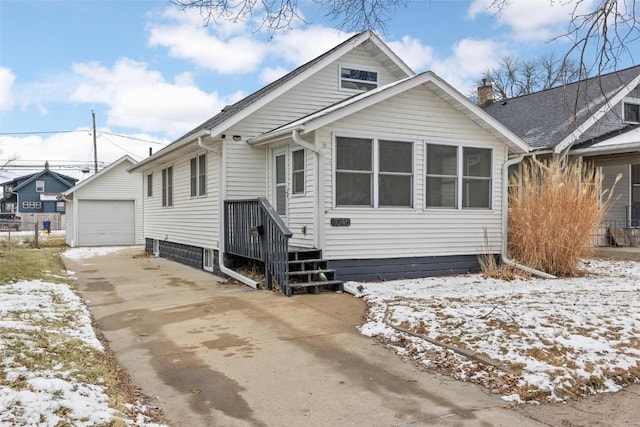 view of front of home featuring a garage and an outdoor structure