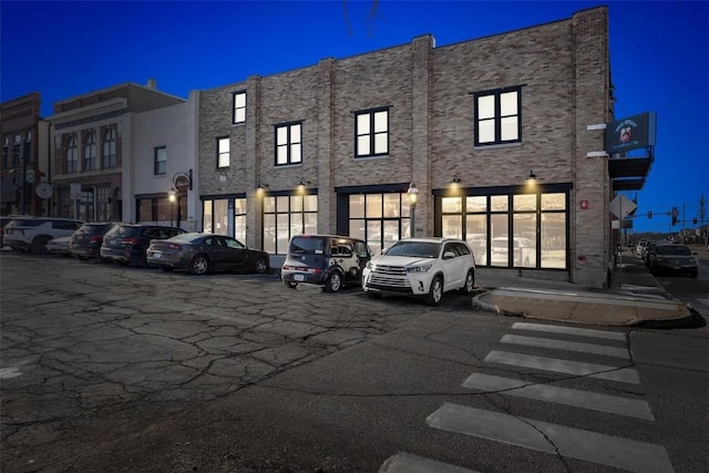 view of parking at twilight