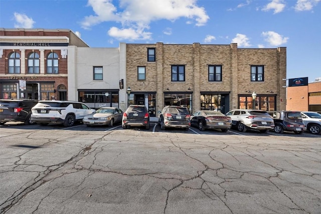 view of property featuring uncovered parking