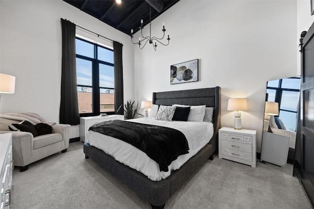 bedroom with high vaulted ceiling and light carpet