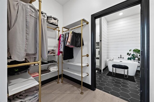 walk in closet featuring hardwood / wood-style floors