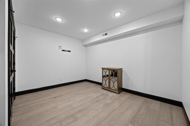 spare room featuring light wood-type flooring