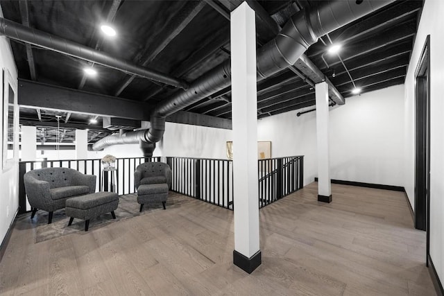 basement featuring hardwood / wood-style flooring