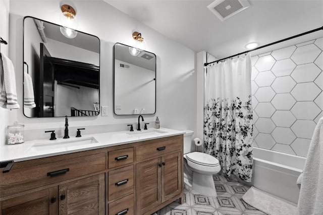 bathroom with double vanity, shower / tub combo, visible vents, and a sink