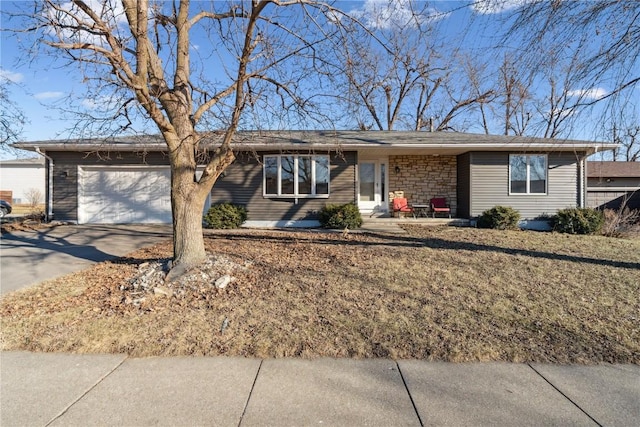 ranch-style home featuring a garage