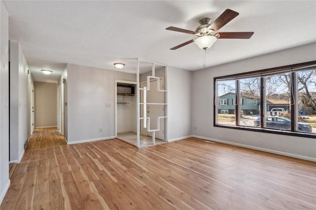 interior space featuring light hardwood / wood-style floors and ceiling fan