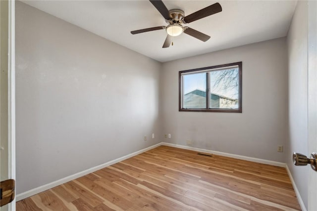 unfurnished room with ceiling fan and light wood-type flooring