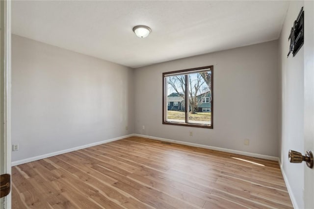 spare room with light wood-type flooring