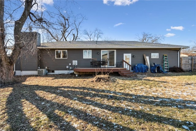 rear view of house featuring a deck, a yard, and central air condition unit