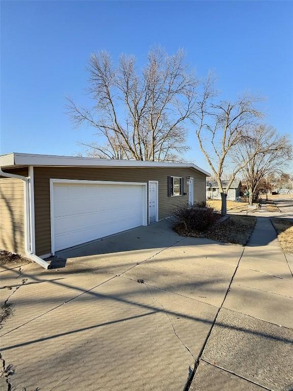 view of front of property featuring an outbuilding and a garage