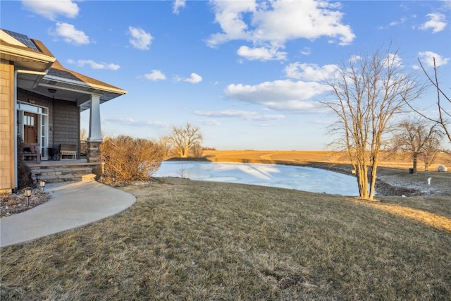 view of yard with a water view