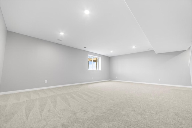 basement featuring light carpet