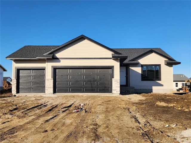 ranch-style home with a garage